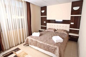 Family Suite, 1 Bedroom, Balcony, City View | 1 bedroom, desk, blackout curtains, free WiFi