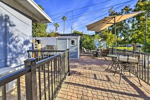 A patio area with a brick floor, outdoor furniture, and a small shed. - Near Cubs Spring Training! Couples Retreat in Mesa (Mesa)
