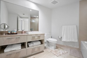 Bathtub, hair dryer, towels