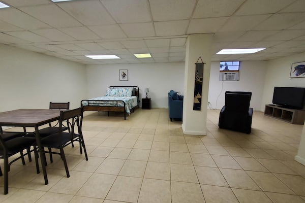 Big open space with Queen bed, dining area, queen sofa bed, recliner and TV