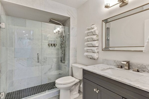 Shower, hair dryer, towels, soap