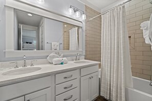 Combined shower/tub, hair dryer, towels, shampoo