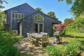 A two-story house with a covered patio area. - Steps to Skaket Beach! (Orleans)