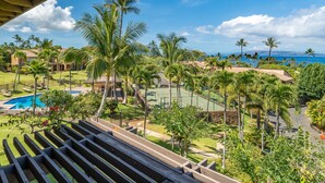 A resort with a pool, tennis courts, and palm trees. - Beautifully remodeled ocean view condo in Wailea WE27B (Kihei)