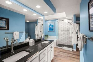 Bathtub, hair dryer, towels, shampoo
