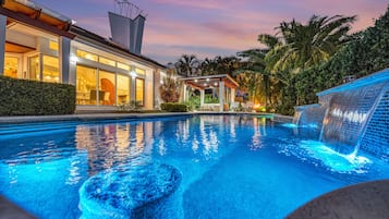 A heated pool, sun loungers