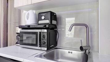 Fridge, microwave, stovetop, coffee/tea maker