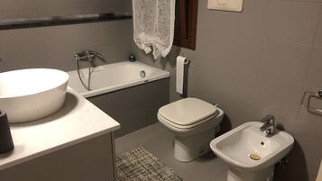 Bathtub, hair dryer, towels