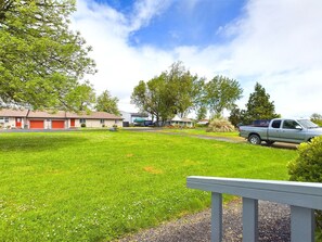 A residential area with houses, a grassy lawn, and a parked truck. - Escape to a beautiful country getaway (Philomath)
