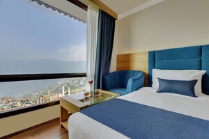 Quarto executivo, 1 cama Queen | 1 quarto, Wi-Fi de cortesia, roupa de cama