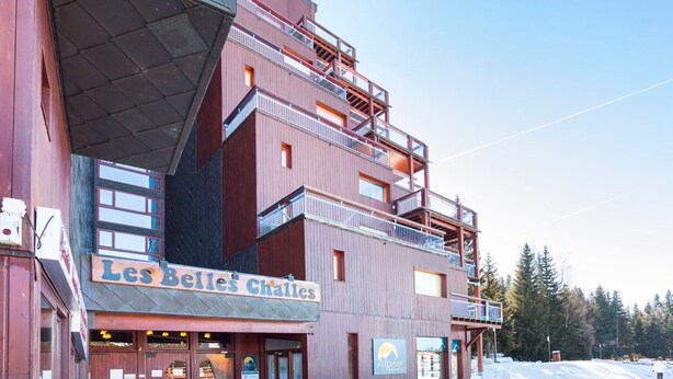 A multi-story building with a sign reading "Les Belles Challes". - Ski-in studio with balcony, sleeps 4 (Les Arcs 1800)