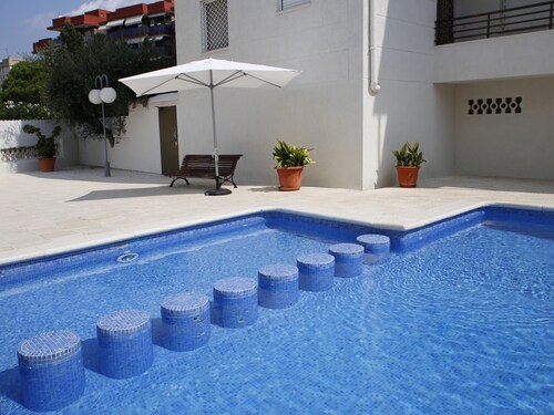 3-Bedroom Apartment with Pool and Parking near Beach