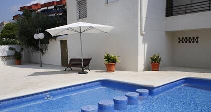 3-Bedroom Apartment with Pool and Parking near Beach