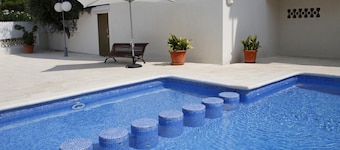 3-Bedroom Apartment with Pool and Parking near Beach