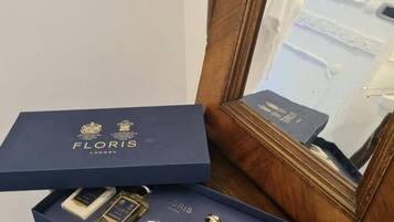 A blue box with 'FLORIS LONDON' branding, containing perfume bottles and a small box.
