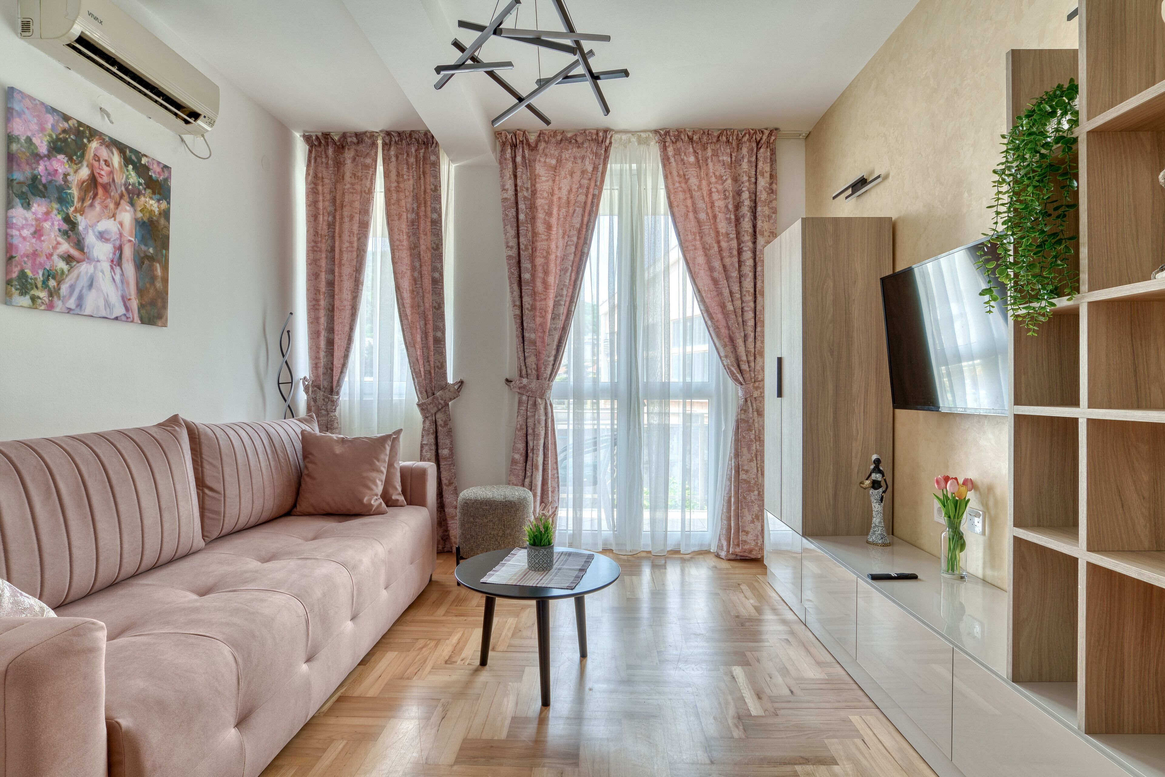 Deluxe Apartment | Living area | 55-inch Smart TV with satellite channels, TV