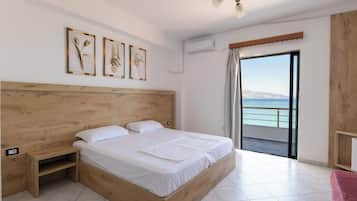 Standard Quadruple Room | Premium bedding, minibar, blackout drapes, iron/ironing board