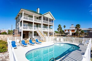 A two-story beachfront house with a pool and lounge chairs. - Hot Days, Cool Savings 20% OFF!!! 4BR/3.5BA Unobstructed Gulf Views (St. George Island)