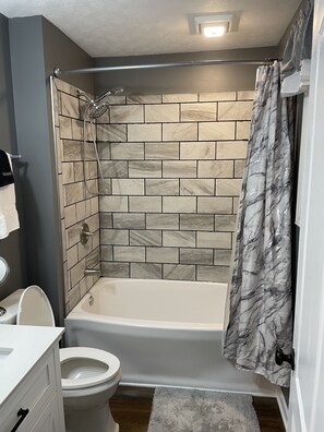 Combined shower/tub, hair dryer, towels, soap