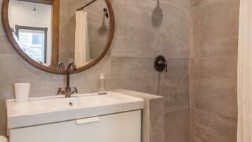 Shower, eco-friendly toiletries, hair dryer, towels