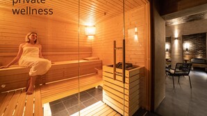 A private wellness area with wooden benches and a sauna. - The Viaduct Suites & More (Prague)