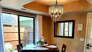 A dining area with a table, chairs, and a chandelier. - Lovely Downtown Condo, Walk to Historic Downtown! (Flagstaff)