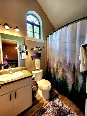 Combined shower/bathtub, hair dryer, towels, soap