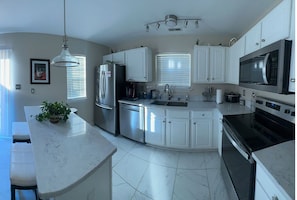 Fridge, microwave, oven, stovetop - Pearlitah: Luxe 3BR King Ensuite, 4 Beds, Semi-Gated Central location (Greensboro)