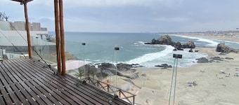 Beachfront house over El Chanque hill with pool, barbecue area and amazing view