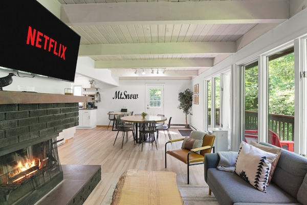 Cozy living space, with wood-burning fireplace, and Roku streaming TV. Kick back