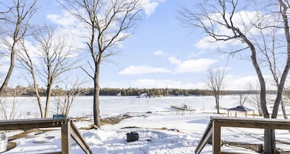 Beautiful cottage on the lake with brand new sauna, large yard and office space.