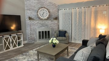 Smart TV, fireplace, books