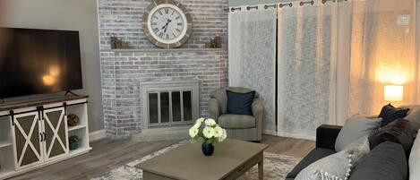 Smart TV, fireplace, books