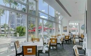 Enjoy a casual dining experience with a view of the surrounding area from this spacious dining area.