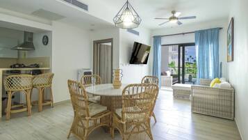 Condo | Living area | 50-inch Smart TV with cable channels, TV