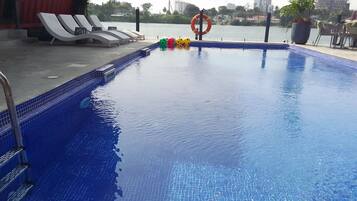 Outdoor pool, free pool cabanas, pool umbrellas