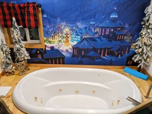 Bathtub, jetted tub, hair dryer, towels