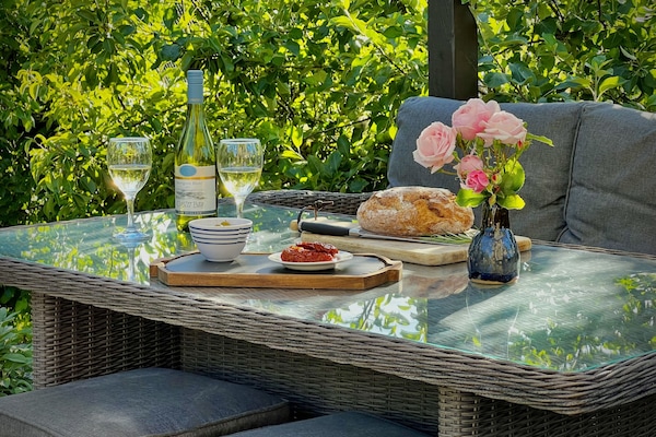 Enjoy outdoor dining and drinks in the comfort of the garden.