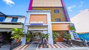 A modern hotel with a prominent sign reading "ROYAL PARK BUSINESS CLASS HOTEL". - HOTEL ROYAL PARK (Chennai)