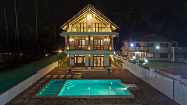A two-story building with a swimming pool in front. - Villa Calangute Phase 11 (Calangute)