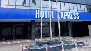 A modern hotel building with a blue sign reading "HOTEL EXPRESS". - HOTEL EXPRESS (Luanda)