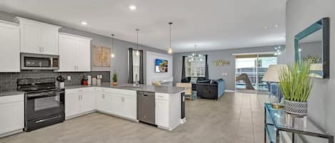 Coffee/tea maker, fridge, microwave, oven