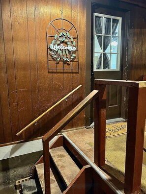 Staircase leads to an upper level with a welcoming atmosphere.