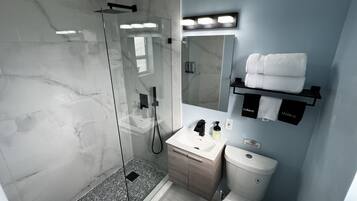 Shower, hair dryer, towels, soap