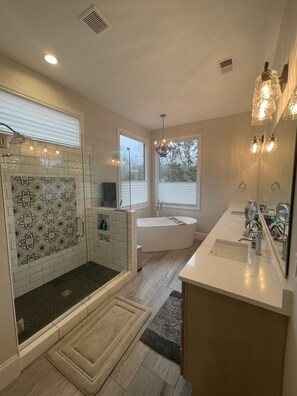 Combined shower/tub, hair dryer, towels, soap