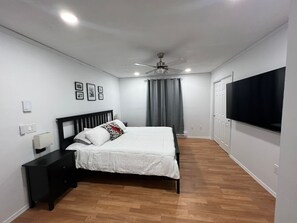 Master bedroom/king size bed and private bathroom with a jacuzzi 