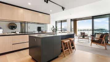 Deluxe Apartment, 2 Bedrooms | Private kitchen | Full-size fridge, oven, stovetop, dishwasher