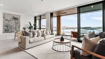 Deluxe Apartment, 2 Bedrooms | Living area | 55-inch Smart TV with satellite channels, TV, heated floors