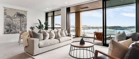 Deluxe Apartment, 2 Bedrooms | Living area | 55-inch Smart TV with satellite channels, TV, heated floors