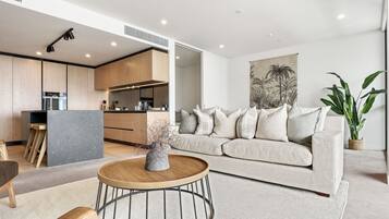 Deluxe Apartment, 2 Bedrooms | Living area | 55-inch Smart TV with satellite channels, TV, heated floors